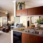 - Applying Folk Art Home Decor Dark Wax to enhance, antique, and protect wood furniture