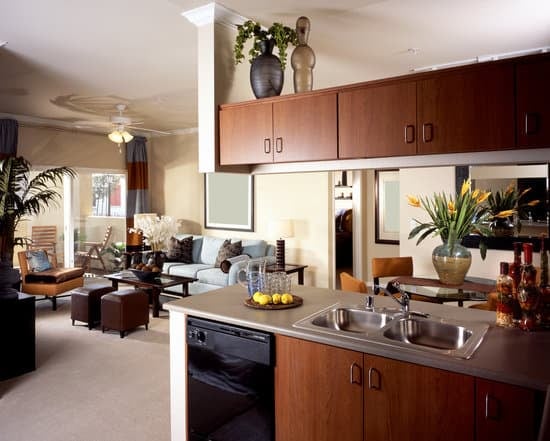 - Applying Folk Art Home Decor Dark Wax to enhance, antique, and protect wood furniture