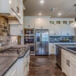 Traditional home office with mahogany desk, leather chair, and vintage decor
